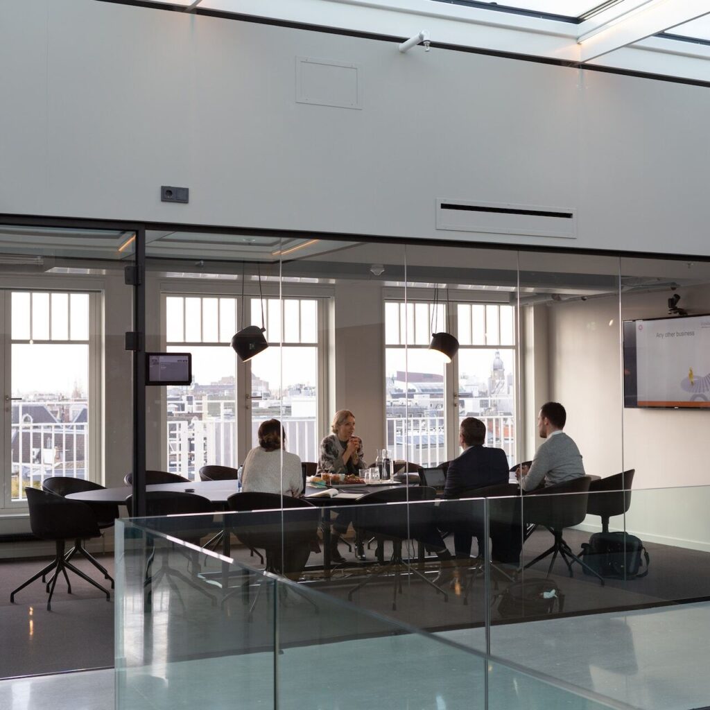 People talking in a conference room.