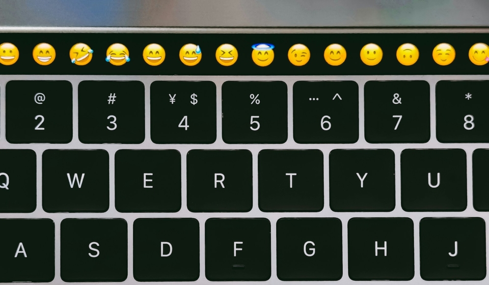 Emojis and emoticons on a keyboard